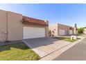 Inviting street view highlighting well-maintained homes with red tile roofs at 3345 E University Dr # 29, Mesa, AZ 85213