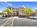 Inviting townhome with lush landscaping, beautiful stone accents, and a well-maintained yard at 4777 S Fulton Ranch Blvd # 2101, Chandler, AZ 85248