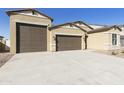 Attractive single-Gathering home with a spacious three-car garage and neutral-toned exterior at 4946 W Weeping Willow Way, Laveen, AZ 85339