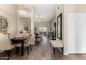 Charming dining area featuring a dark wood table, upholstered chairs, and open view to living space at 5335 E Shea Blvd # 2047, Scottsdale, AZ 85254