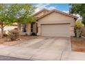 Charming single-story home with a two-car garage and low maintenance front yard at 8325 N 61St Ln, Glendale, AZ 85302
