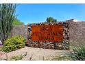 Scottsdale Trails community sign with natural rock, stone and native plants at 8625 E Belleview Pl # 1012, Scottsdale, AZ 85257
