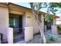 Inviting condo entrance features secure gate, desert landscaping, and clear unit number for easy identification at 8625 E Belleview Pl # 1012, Scottsdale, AZ 85257
