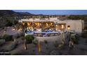 Expansive aerial view showcasing the estate's private pool area, desert landscaping, and stunning architectural design at 9188 E Bajada Rd, Scottsdale, AZ 85262