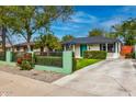 This charming single story house boasts mature trees, landscaping and a long driveway at 1326 E Almeria Rd, Phoenix, AZ 85006