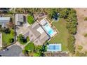 This aerial view displays the full backyard featuring a pool, tennis court, playground, and large grassy area at 1632 S Alba Cir, Mesa, AZ 85204