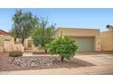 Charming home featuring desert landscaping with rocks and desert plants at 2167 E Aspen Dr, Tempe, AZ 85282