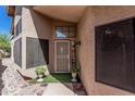 Stylish front entrance with security door, planters and pavers, creating a welcoming entryway at 2348 W Comstock Dr, Chandler, AZ 85224