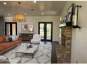 Inviting living room featuring fireplace, plush sofa, and stylish decor at 2904 W Belmont Ave, Phoenix, AZ 85051