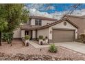 Inviting two-story home with a tiled roof, lush landscaping, and a spacious two-car garage at 3135 W Molly Ln, Phoenix, AZ 85083