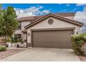 Charming two-story home featuring a large two-car garage and a well-maintained front yard at 3135 W Molly Ln, Phoenix, AZ 85083