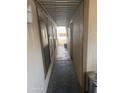 Covered walkway between the home and carport with neutral toned exteriors at 3330 E Main St # 332, Mesa, AZ 85213