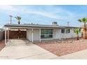 Charming single-story home featuring desert landscaping, a covered parking area, and neutral paint at 3707 W Elm St, Phoenix, AZ 85019
