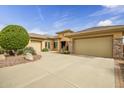 Stylish one-story home showcasing a circle driveway, desert landscaping, and a two-car garage at 41819 N Anthem Ridge Dr, Phoenix, AZ 85086