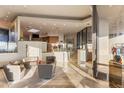 Open-concept living room with a glass wall, modern decor, and abundant natural light at 41823 N 111Th Pl, Scottsdale, AZ 85262