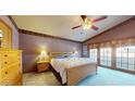 Relaxing primary bedroom featuring carpet floors, private access, and generous natural light for rest at 6720 W Mcrae Way, Glendale, AZ 85308