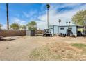 Spacious backyard featuring a utility vehicle, shed, and open area perfect for outdoor activities and storage at 8218 S 7Th St # 163, Phoenix, AZ 85042