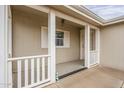 Welcoming covered front porch with white railings, offering a cozy and inviting entrance at 890 E Tee St, San Tan Valley, AZ 85140