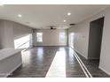 Open-concept living room with wood-look floors and plenty of natural light at 10005 W Mission Dr, Arizona City, AZ 85123
