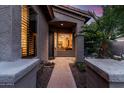 Inviting front entry with a view to the interior, framed by mature landscaping and natural light at 1528 E Harrison St, Gilbert, AZ 85295
