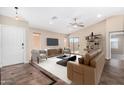 Bright living room with modern furniture and sliding glass door, perfect for entertaining and relaxing at 16508 N 114Th Dr, Surprise, AZ 85378
