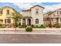 Inviting two-story home with mature tree, decorative front yard and covered porch at 2571 S Melvin St, Gilbert, AZ 85295