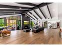 Expansive living room with floor-to-ceiling windows, sleek fireplace, and open floor plan at 5040 N Arcadia Dr, Phoenix, AZ 85018