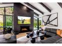 Sophisticated living room with a modern fireplace, high ceilings, and comfortable seating at 5040 N Arcadia Dr, Phoenix, AZ 85018