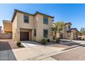 Two-story home with a two-car garage and desert landscaping in a suburban neighborhood at 5233 W Albeniz Pl, Phoenix, AZ 85043