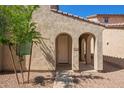 Inviting entrance featuring a covered entryway with arched detailing and a well-maintained walkway at 5472 W Fulton St, Phoenix, AZ 85043