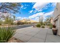 Wide driveway leading to a home with a mountain view on a sunny day at 6181 E Brilliant Sky Dr, Scottsdale, AZ 85266