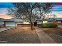 Inviting single-story house with a well-kept yard, a brick path, and a welcoming front entrance at 6938 E Flossmoor Ave, Mesa, AZ 85208
