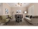 Bright living room with a neutral color scheme, stylish furniture, and elegant decor at 8367 W Lariat Ln, Peoria, AZ 85383