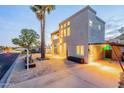 Stylish two-story home with large windows, desert landscaping, and accent lighting, located in a quiet neighborhood at 9834 N 1St St, Phoenix, AZ 85020