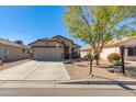 Charming single-Gathering home featuring a low maintenance yard and a concrete driveway with basketball hoop at 995 E Vernoa St, San Tan Valley, AZ 85140