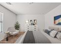 Cozy bedroom featuring a comfortable bed, stylish decor, and ample natural light at 148 E Douglas Ave, Coolidge, AZ 85128