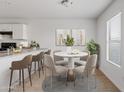 Bright dining area with a modern table set perfect for Gathering meals and entertaining guests at 148 E Douglas Ave, Coolidge, AZ 85128