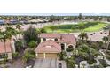 Beautiful aerial view of a home situated on a well-maintained golf course, surrounded by lush landscaping at 15948 W Sheila Ln, Goodyear, AZ 85395