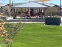 Community playground featuring colorful play equipment under a covered picnic area, offering a fun outdoor space for  at 23781 N 162Nd Ave, Surprise, AZ 85387