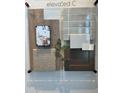 Elevated design center selections showcasing wood floors, grey brick, and neutral colored carpet at 25215 W Wayland Dr, Buckeye, AZ 85326