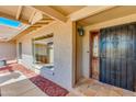 Inviting entryway with a security door, decorative window, and tiled porch at 302 E Carol Ann Way, Phoenix, AZ 85022