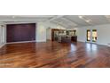 Bright open-concept living area with wood floors and modern design at 302 E Carol Ann Way, Phoenix, AZ 85022