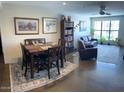 Open-concept living room and dining area with stylish furnishings and natural light at 5110 N 31St Way # 345, Phoenix, AZ 85016