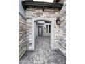 Covered entryway featuring stone walls and decorative pavers at 6790 S Springs Pl, Chandler, AZ 85249