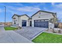 Stunning modern elevation featuring a two car garages, pavers, artificial turf, and wrought iron at 6790 S Springs Pl, Chandler, AZ 85249