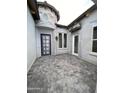 Private courtyard featuring stone accents, stucco walls, and decorative pavers at 6790 S Springs Pl, Chandler, AZ 85249