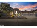 Charming home featuring well-maintained landscaping, three car garage, and a lovely desert yard at 76 W Stacey Ln, Tempe, AZ 85284