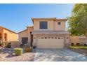 Two-story home featuring a two-car garage, neutral color scheme and low maintenance landscaping at 8637 W Kathleen Rd, Peoria, AZ 85382