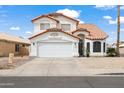 Two-story home featuring a red tile roof, a two car garage, and neutral color palette at 9818 W Pontiac Dr, Peoria, AZ 85382