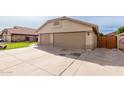 Three-car garage showcasing a spacious driveway at 11251 E Pratt Ave, Mesa, AZ 85212